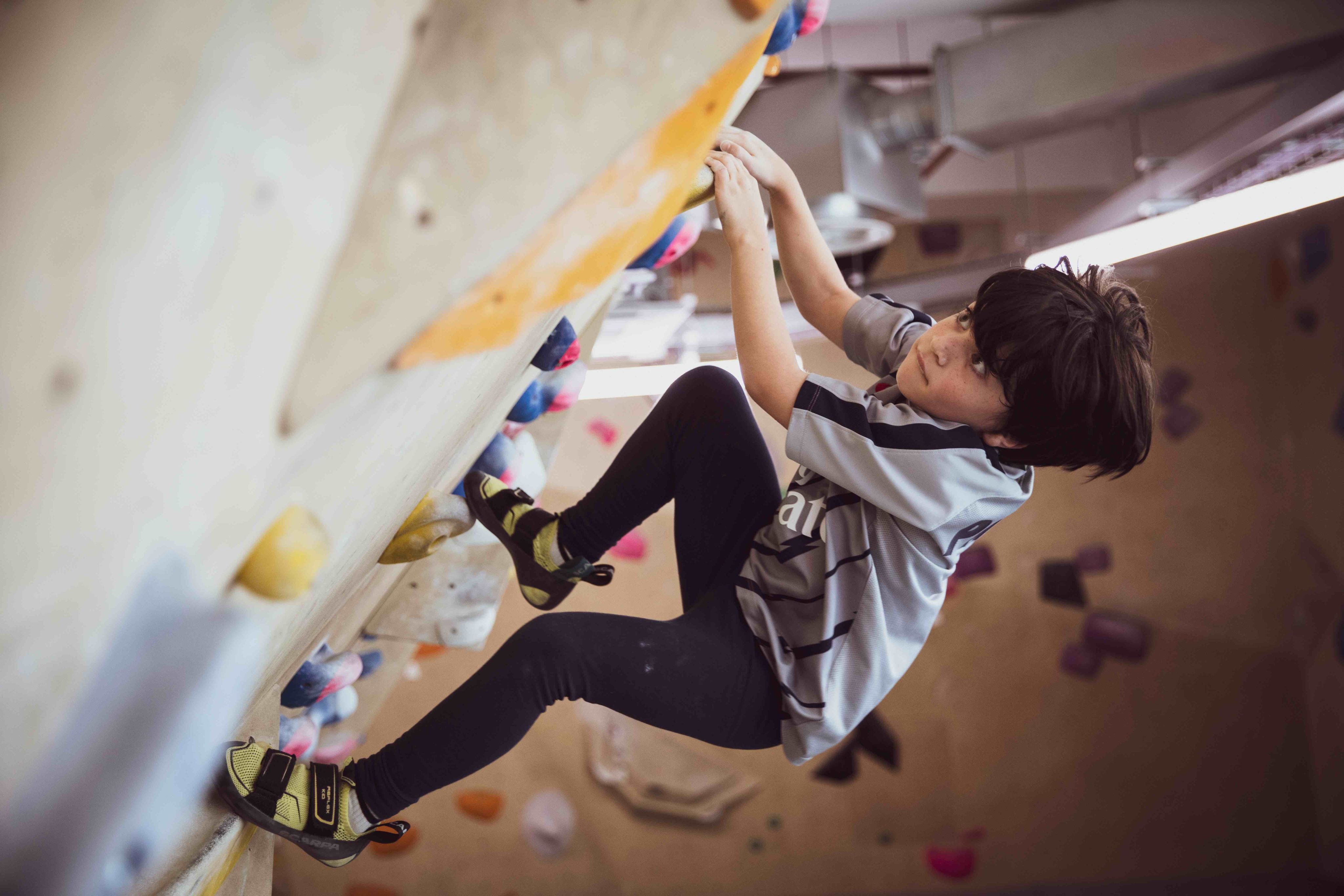 A child using the climbing wall at IndiRock